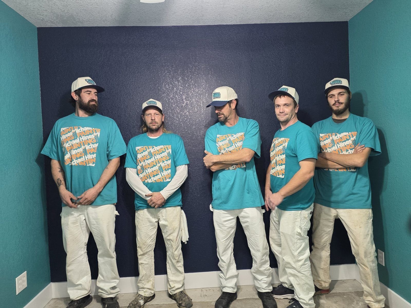 The Michael Hines Painting crew in company shirts