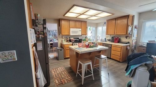 A kitchen with dated oak cabinets before painting