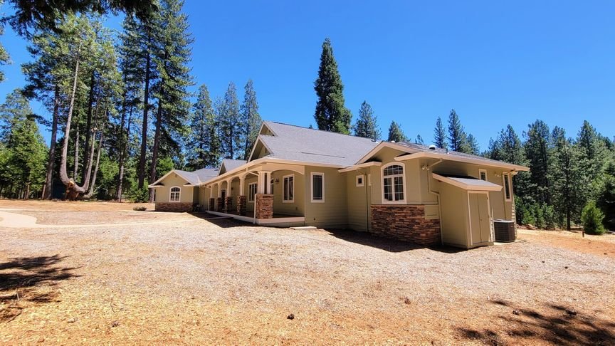A sage craftsman home in the pines, body and trim freshly repainted